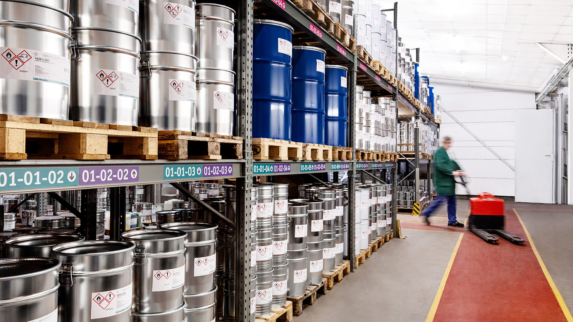 Oblique view of a high-bay warehouse with paint drums